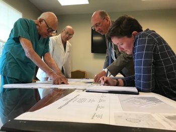 Dr. Buhite Sr. and Dr. Buhite Jr. meet with the architects for the Buhite-DiMino Center for Implant Dentistry